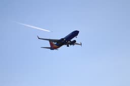 Southwest Airlines aircraft with distinctive livery at airport gate
