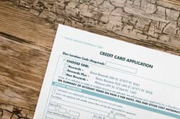 Chase Sapphire credit cards fanned out next to a passport and boarding pass