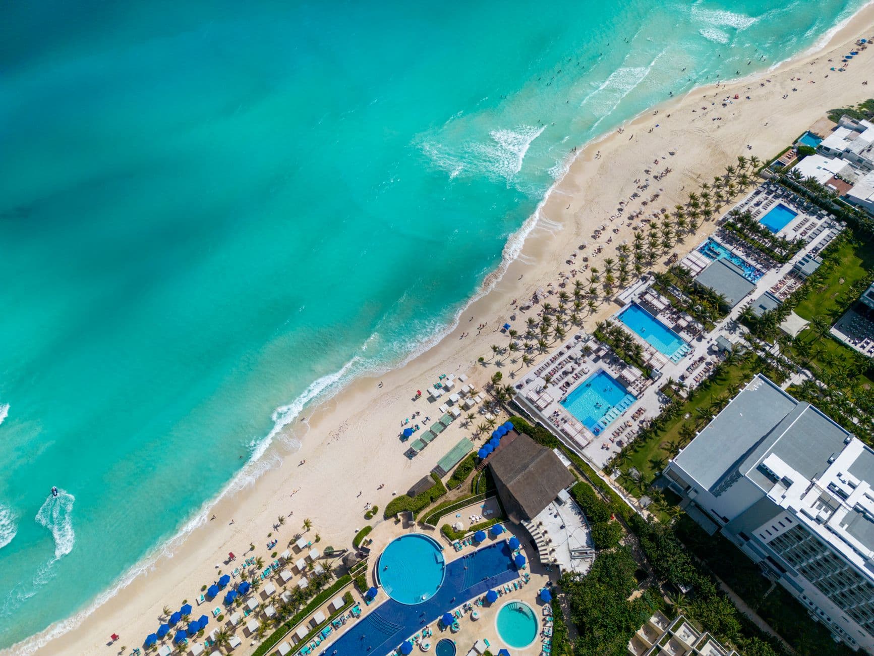Colorful beachfront view of Cancun Mexico with turquoise water