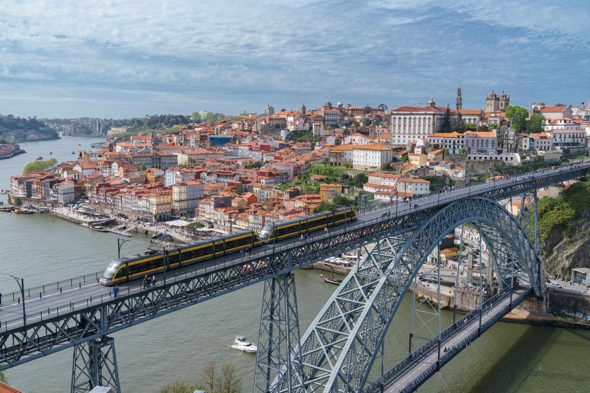 Porto cityscape with Dom Luis I Bridge over the Douro River at golden hour