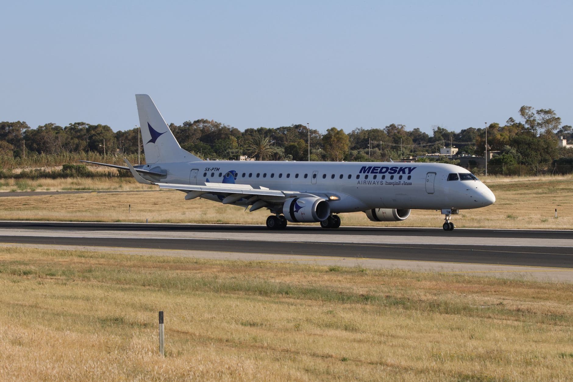 Breeze Airways aircraft with blue livery parked at terminal