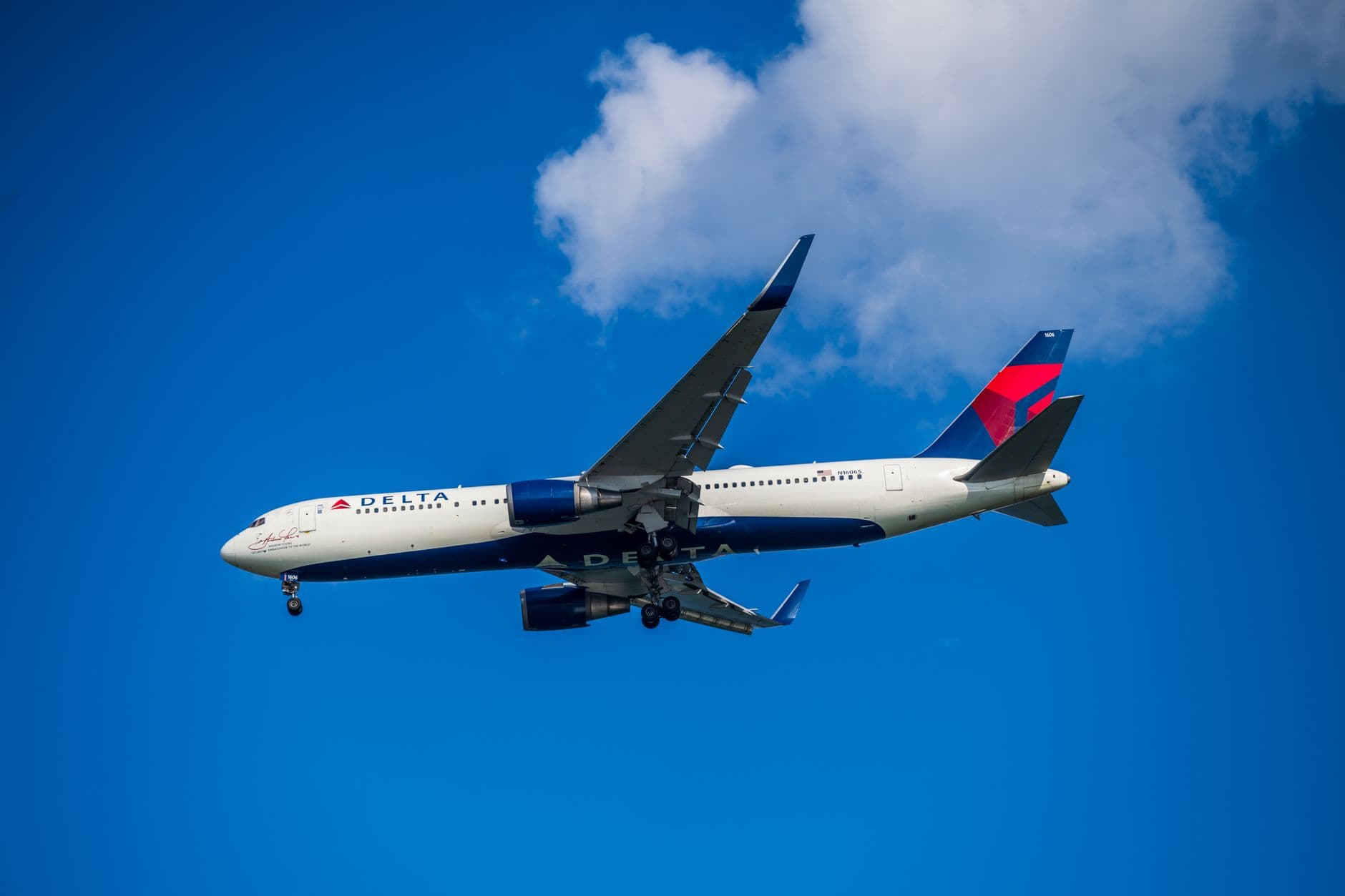 Delta Air Lines aircraft with distinctive blue and red livery on tarmac