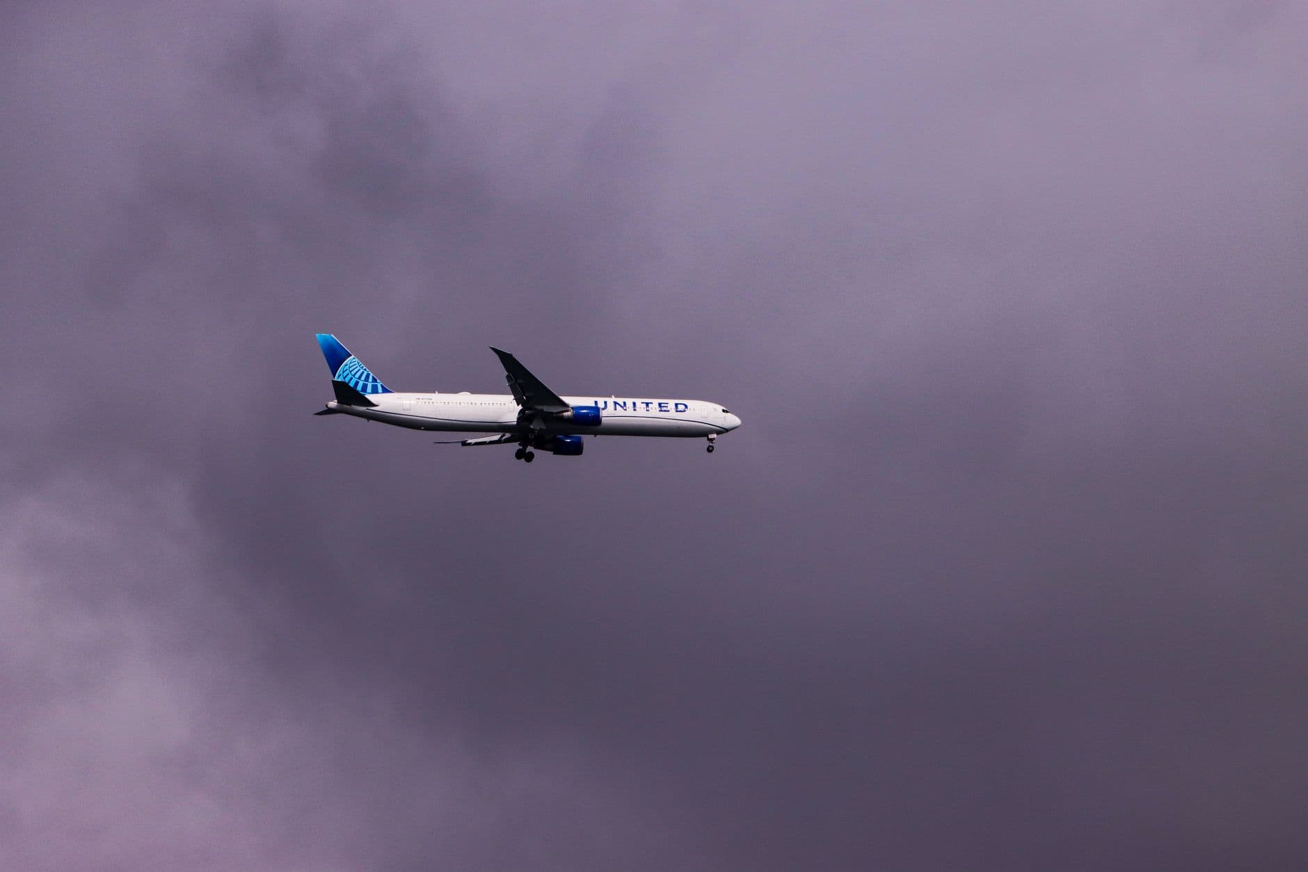 United Airlines aircraft with modern livery at airport terminal