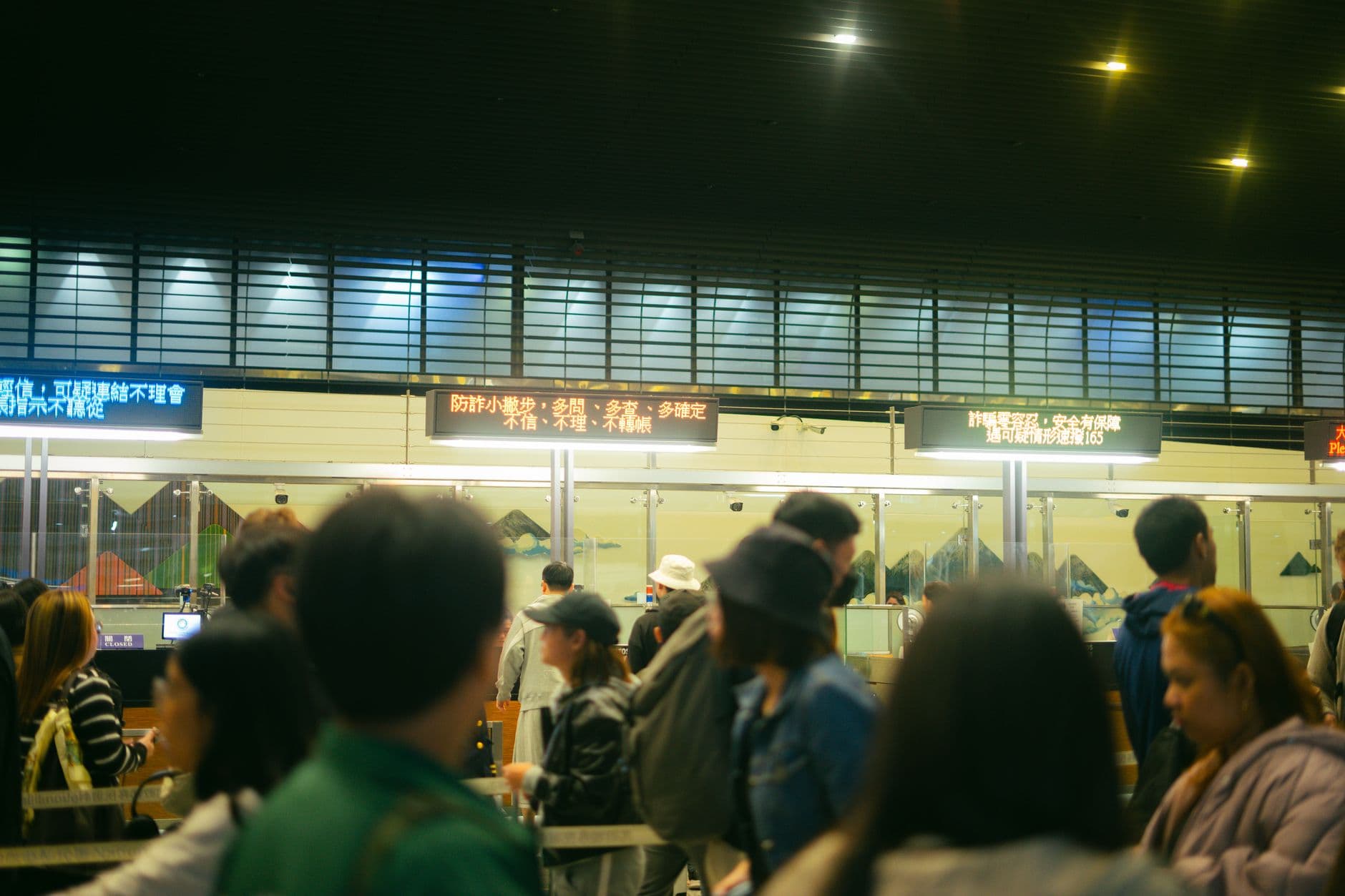 Airport check-in counter with passengers and airline staff