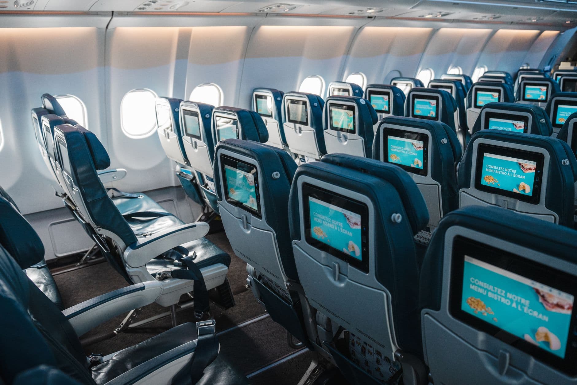 Premium economy seat with extra legroom in airplane cabin