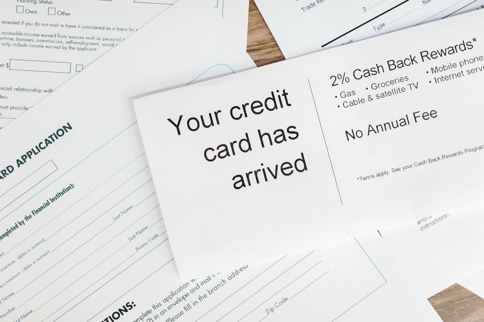 Travel rewards credit cards arranged on table for points earning