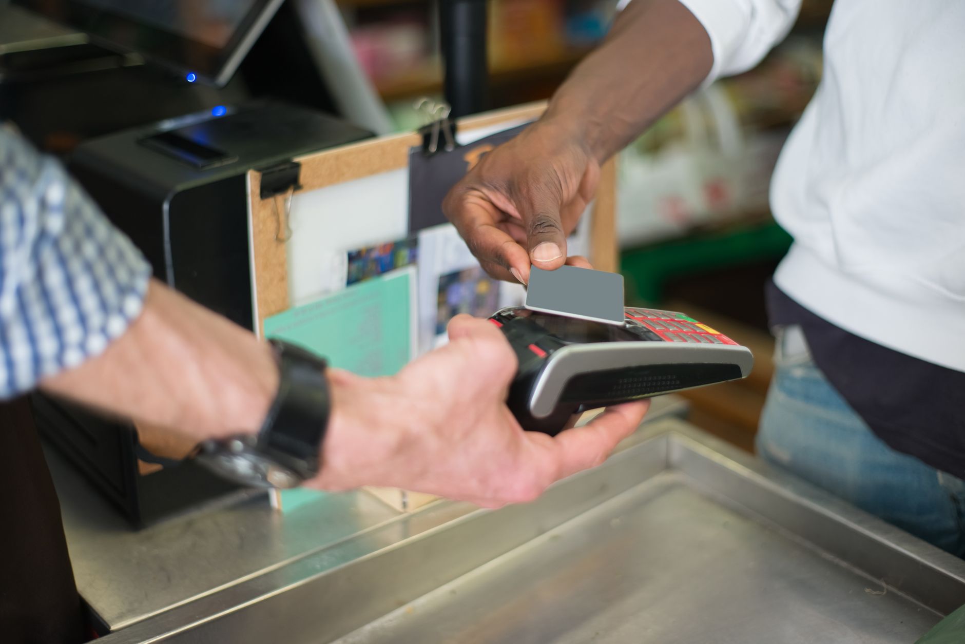 Contactless travel rewards card being tapped at a reader